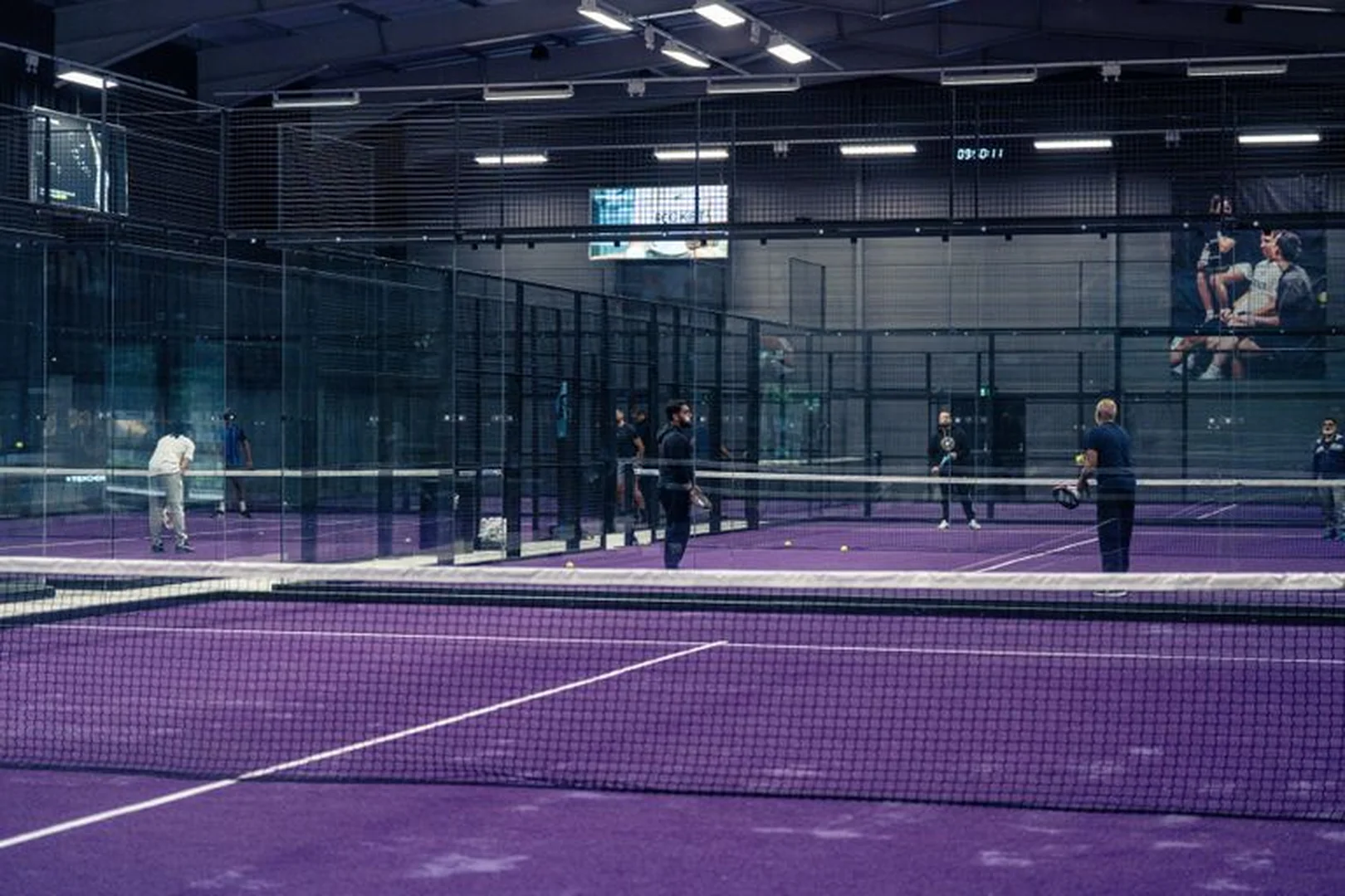 Rocket Padel Beckton — multiple indoor courts with purple floor, London